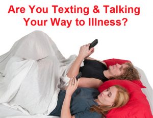 couple in bed texting on cell phones