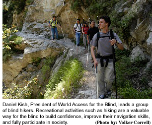 world-access-Daniel-Kish-leads-group hike with photo credit